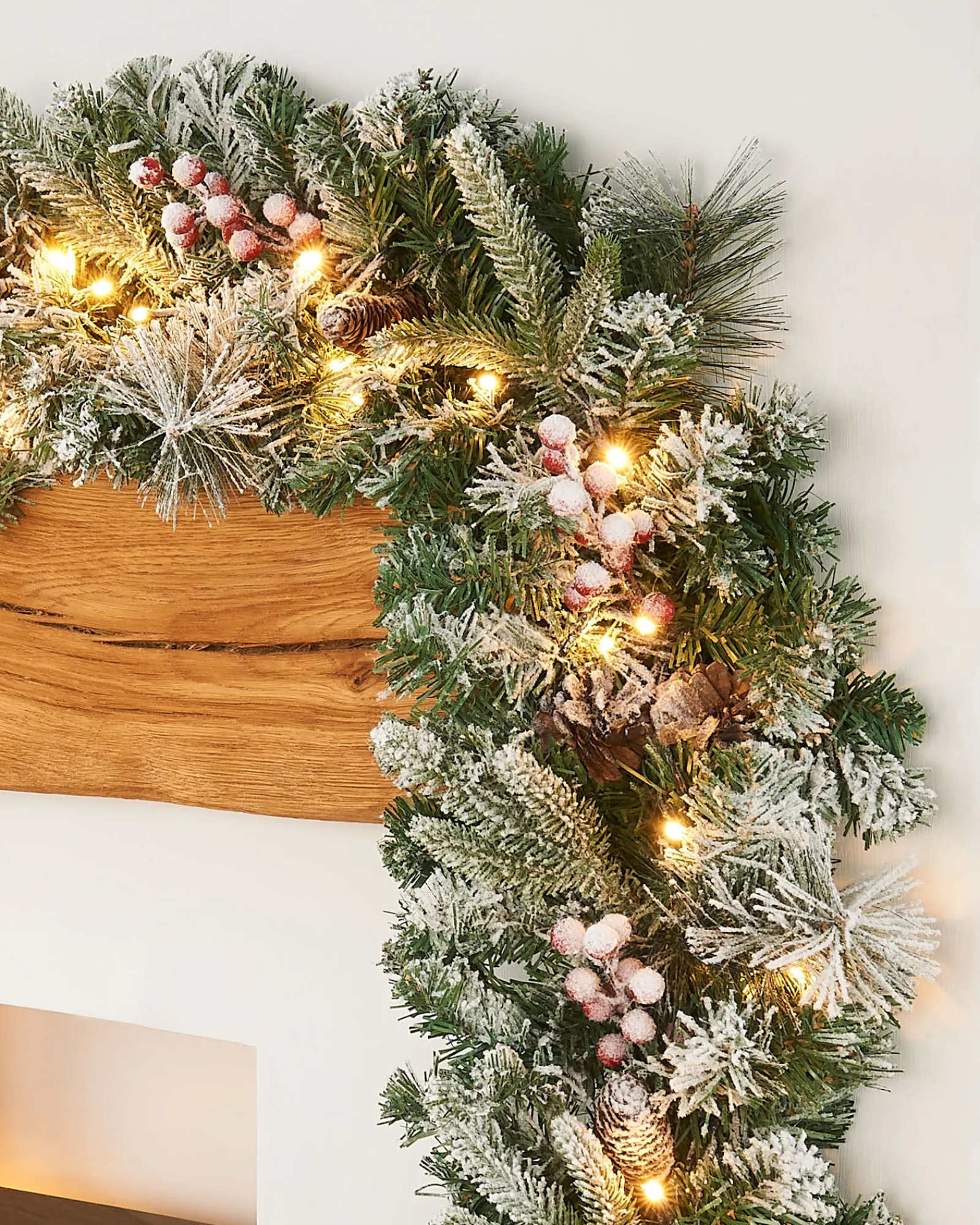 WeRChristmas Pre-Lit Extra Thick Mixed Pine Snow Flocked Garland, Pinecones & Berries, 9 Ft
