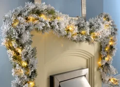 WeRChristmas Pre-Lit Snow Flocked Spruce Garland, 9 Ft